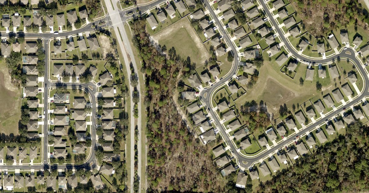 Aerial view of Costanzo Poolside Paradise and its surroundings
