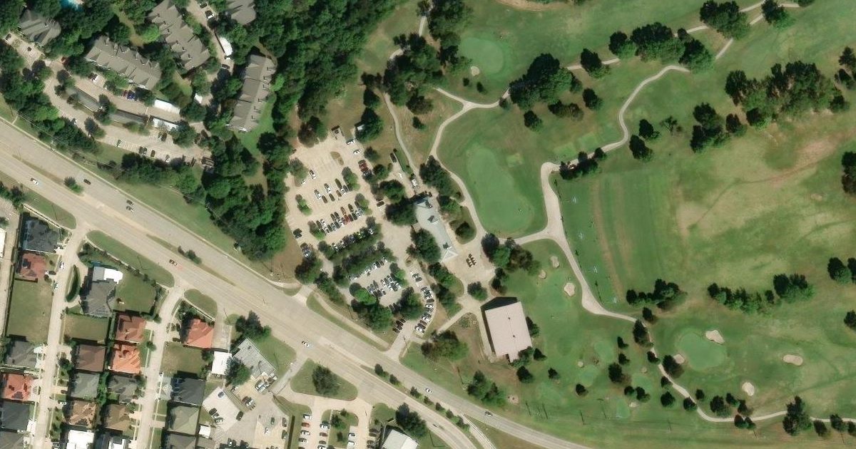 Aerial view of Pecan Hollow Golf Course and its surroundings